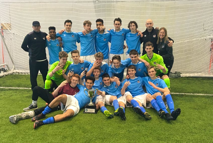 The Newfoundland and Labrador boys under-18 team celebrates after winning the Atlantic Showcase tourney Sunday in Halifax. The team went 3-0, winning each of its game by 4-0 scores.