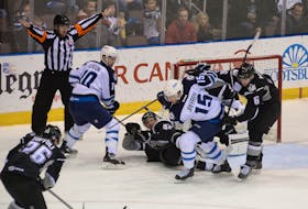 In this file photo, St. John’s IceCaps forwards Andrew Gordon and Jason Jaffray hunt down a loose puck in front of the Manchester Monarchs’ goal as Monarchs Tyler Toffoli, Jeff Schultz (55) and Colin Miller (6) look on. The IceCaps, and the AHL’s St. John’s Maple Leafs before them, had to deal with higher-than-normal travel costs, and not just for themselves. They also paid a travel subsidy to visiting teams like Manchester. The Monarchs will have their plane travel costs to St. John’s covered again in 2018-19, but this time as a member of the ECHL as they come here to take on the league’s newest entry, the Newfoundland Growlers. — Telegram file photo/Keith Gosse