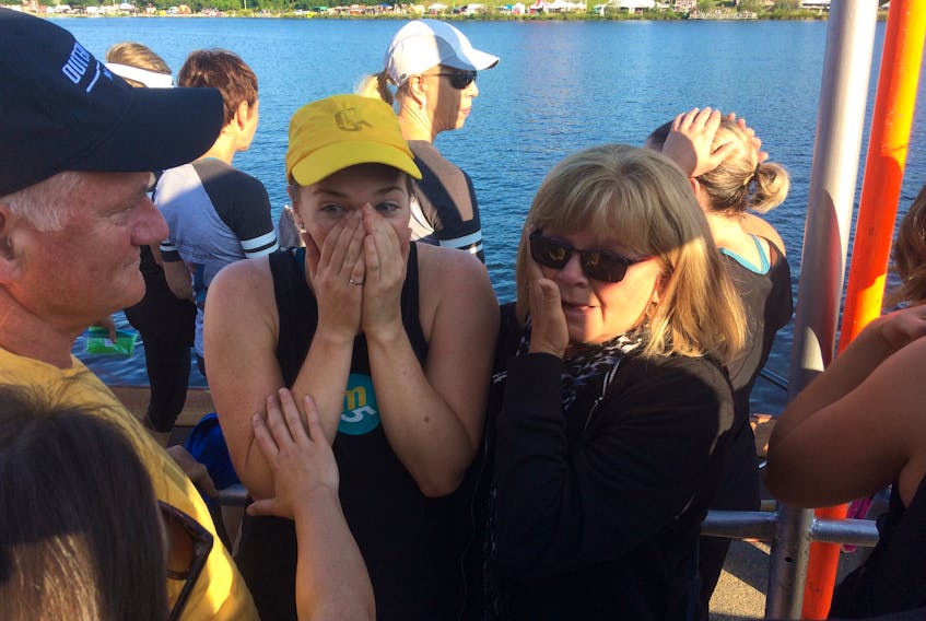 Here's a record reaction. Amanda Ryan, No. 2 oar on the m5 women’s team, along with her mother, Cheryl (right), wipe away tears of joy after m5 established a new Royal St. John’s Regatta course record Wednesday morning at Quidi Vidi Lake. To the left is Owen Devereaux, father of m5 No. 5 oar Alyssa Devereaux. Owen Devereaux knows about records, having rowed with the 1982 Outer Cove team which regained the course record from Smith Stockley.