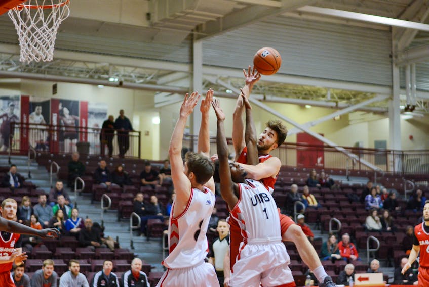The Memorial Sea-Hawks’ Nathan Barker, shown taking the ball to the hoop against to University of New Brunswick Varsity Reds, had 26 and 27 points, respectively, in weekend AUS men’s basketball games at the Field House in St. John’s, Barker is the second-leading scorer in the conference, with 21.3 points per game.