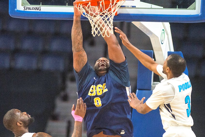 Glen Davis of the St. John's Edge misses a finishing off a dunk as Halifax Hurricanes forwards Chadrack Lufile (left), a former Edge player for a brief period of time, and Mike Poole defend in the first half of Sunday afternoon’s NBL Canada game at the Scotiabank Centre.