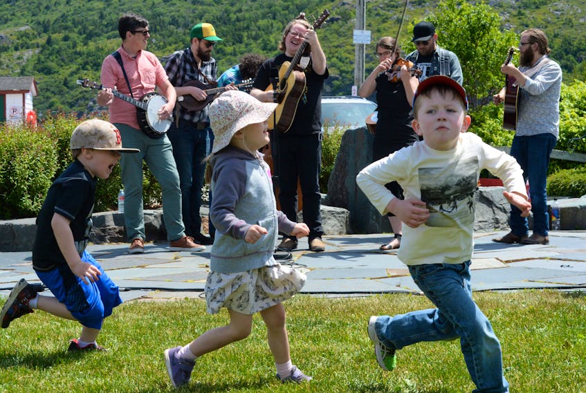 A trio of galloping youngsters strut their stuff on the lawn of the Harbourside Park in downtown St. John's as they enjoy headline performers the High and Lonesome Ramblers during the lunch-hour concert on Friday.