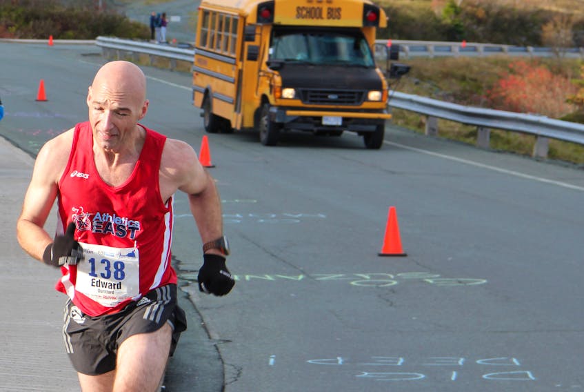 Ed Durnford, shown here closing out a recent Cape to Cabot road race on Signal Hill, is the course record-holder in the masters division.