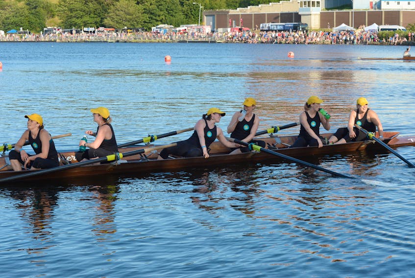 Members of the m5 women's crew celebrate their victory in the women's championship race Wednesday evening at Quidi Vidi in St. John's. Earlier in the day the crew broke the 15-year-old women's course record with a time of 4:56.10.