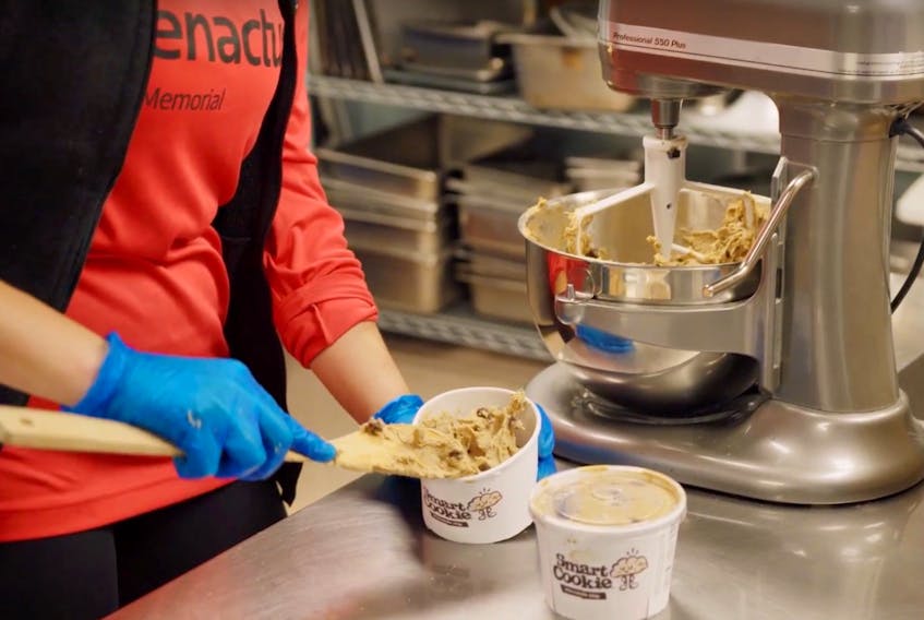 Members of Enactus Memorial dish out Smart Cookie, a health-conscious cookie dough that will raise funds for breakfasts for kids.