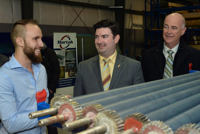 Tourism, Culture, Industry and Innovation Minister Christopher Mitchelmore (centre) and Avalon MP Ken McDonald (right) visited the Martak Canada Ltd. facility on McNamara Drive in Paradise Wednesday afternoon.