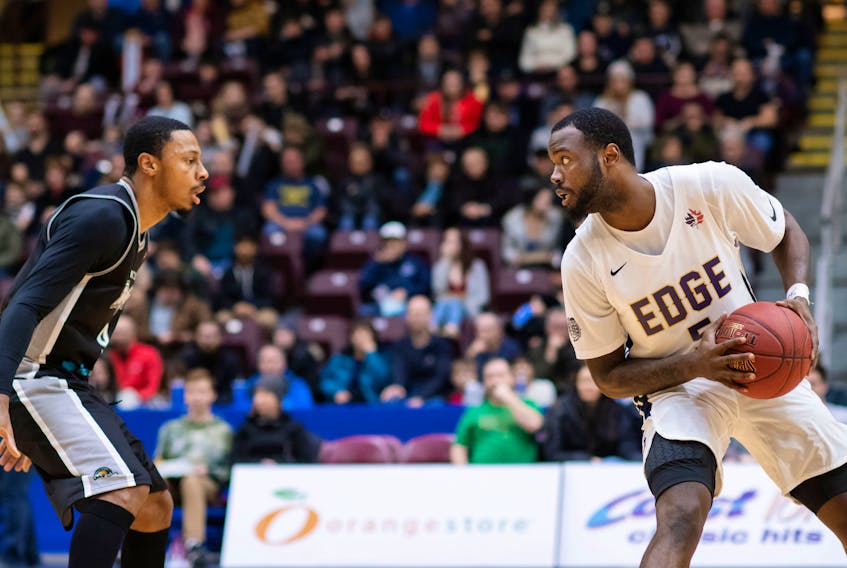 St. John’s Edge Dez Lee (right), shown facing the Moncton Magic’s Gentrey Thomas earlier this season, has scored 20 or more points in his last six games. That includes the first three games of a road trip that continues tonight in Saint John, N.B. — St. John’s Edge photo/Joe Chase