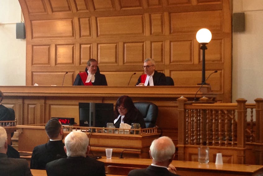 Newly appointed Supreme Court of Newfoundland and Labrador Justice Sandy MacDonald (right) speaks to a gathering in Courtroom No. 1 during his swearing in ceremony as Chief Justice Raymond Justice Whalen looks on.