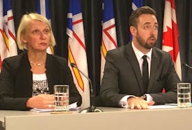 Justice Minister Andrew Parsons speaks to reporters Thursday while announcing government will introduce legislation to create a Serious Incident Response Team (SIRT) in Newfoundland and Labrador. At right is deputy minister Paula Walsh, a former Royal Newfoundland Constabulary officer.