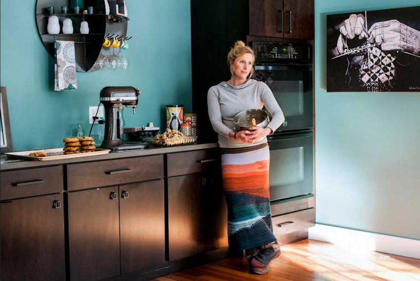 Sarah Stadnicki (Thornhill) stands in her converted dining room, a place where she annually makes chocolate chip cookies for her The 27th Chip home-based company in Brunswick, Maine. - Rachel James: Merritt Photography
