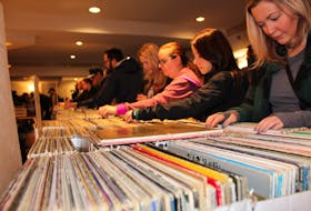 Record enthusiasts flipped through milk crates and boxes full of albums – organizers estimated there were at least 15,000 records for sale at Saturday’s fair.