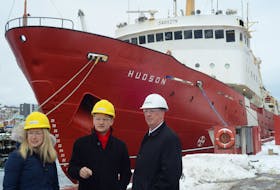 Jane Kelsey, regional director of integrated technical services with Canadian Coast Guard, Atlantic Region, chats Seamus O’Regan, Minister of Indigenous Services and MP for St. John's South–Mount Pearl (centre) and Newdock owner Paul Antle next to the CCGS Hudson following this week’s announcement that Newdock had been awarded the $10-million contract for refit work on the vessel.