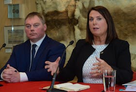 Natural Resources Minister Siobhan Coady speaks at a news conference in St. John’s Monday as deputy minister Ted Lomond looks on.