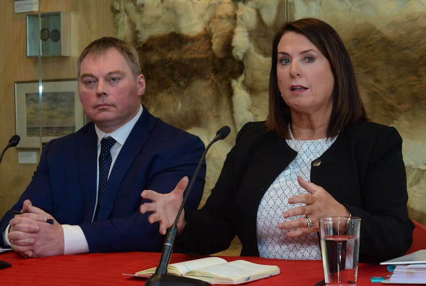 Natural Resources Minister Siobhan Coady speaks at a news conference in St. John’s Monday as deputy minister Ted Lomond looks on.