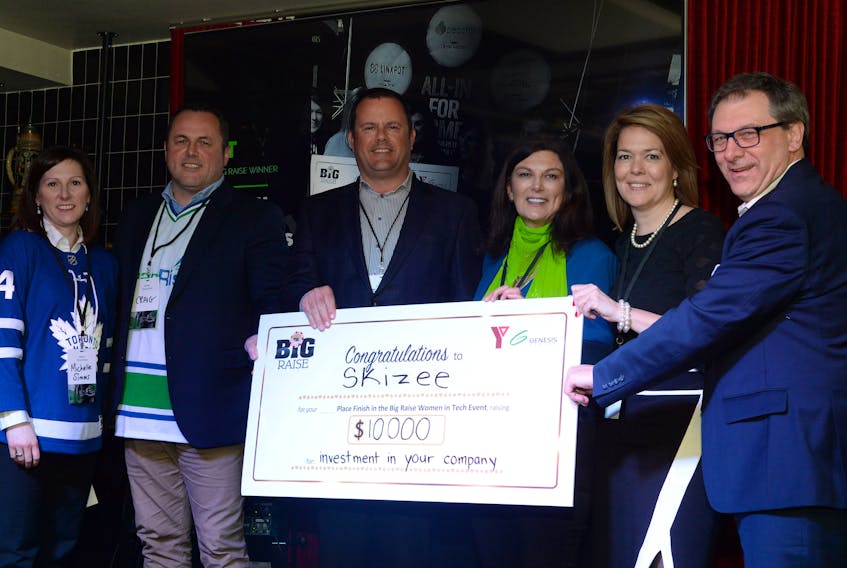Donna Paddon (fourth from left) is presented with her cheque by the Genesis Centre Pitch & Pick organizers and supporters. Others shown (from left) are MUN Genesis Centre CEO Michelle Simms, Craig Rowe, Craig Tucker, Paddon, Jocelyn Perry and Jason Browne.