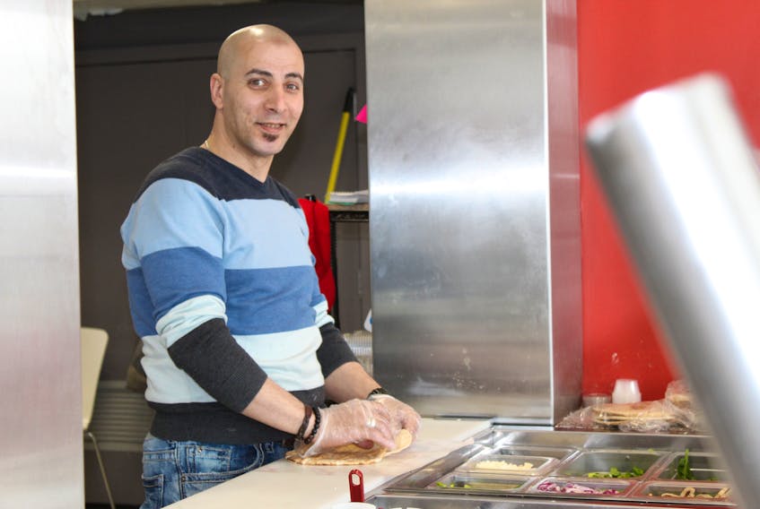 Big Bite Pita co-owner Emad Elawwad provides free meals for people who are homeless every day between 3- 4 p.m.