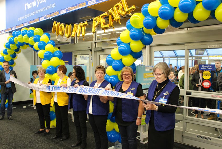 Marie Lockyer, an accounting office associate at Walmart in Mount Pearl, and a group of her colleagues were given the honour of cutting the ribbon to open the revamped Walmart Supercentre on Merchant Drive Thursday morning.