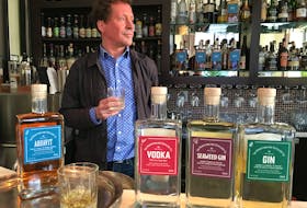 Newfoundland Distillery Co. co-owner Peter Wilkins enjoys a taste of aquavit, the company’s fourth product to be launched this year.