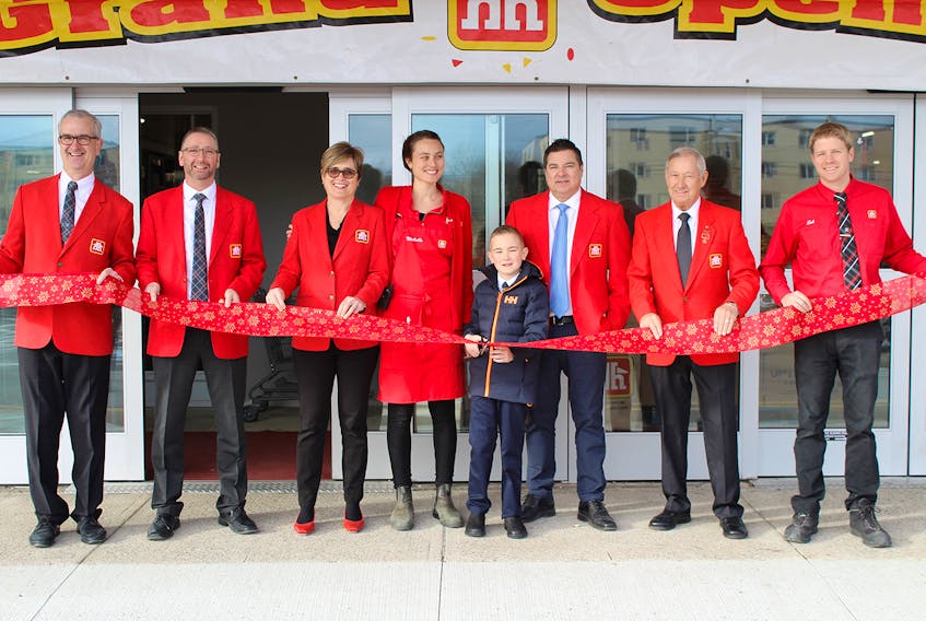 Cutting the ribbon to open the newest Home Hardware location in the province Friday on Torbay Road in St. John's were (from left) Tim Dietrich, Home Hardware's director, retail operations Atlantic; Roy Crawley, Home Hardware's retail operations manager for N.L., store co-owner Christine Hand, store co-manager Michelle Thorup, Blake Smith, co-owner Craig Smith, Clayton Smith and store co-manager Zak Thorup.
