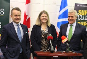 (From left) Federal cabinet minister Seamus O’Regan, Supercluster CEO Kendra MacDonald and Premier Dwight Ball prepare to take questions from reporters in St. John’s on Friday following an announcement on the Ocean Supercluster.