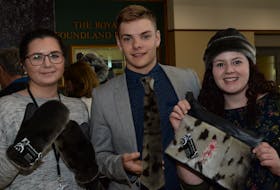 Provincial government employees (from left) Sara Kavanagh, Devon Ryan and Angelica Hill model products from Sealskin Treasures, owned by Laurie Pitcher of Heart’s Content.