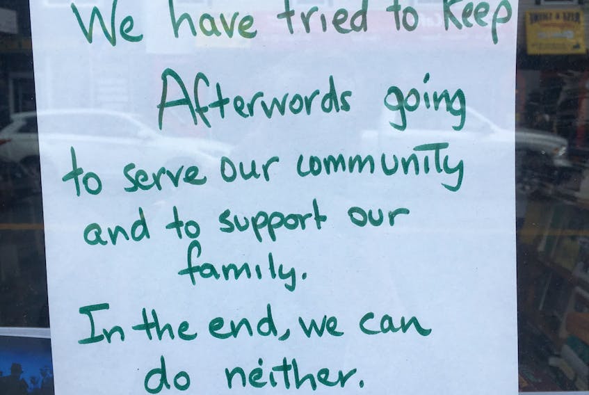 A sign in the window of Afterwords Bookstore in downtown St. John’s announcing its closure.