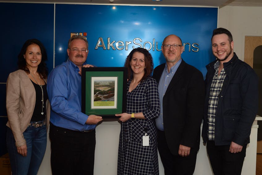 Aker Solutions Canada is the latest company in Newfoundland and Labrador to go carbon neutral through the purchase of carbon offsets. The company purchased offsets for its 95-tonne carbon footprint from Sharp Management Inc. and was presented with its certificate Friday in St. John’s. (From left) Melissa English-Barbour, Aker’s senior health, safety, security and environment (HSSE) manager, Glenn Sharp, Marsha Matthews, Aker’s senior HSSE adviser, Aker’s vice-president/general manager Dave Billard and Matt Rumboldt, Newfoundland and Labrador Environmental Industry Association (NEIA).