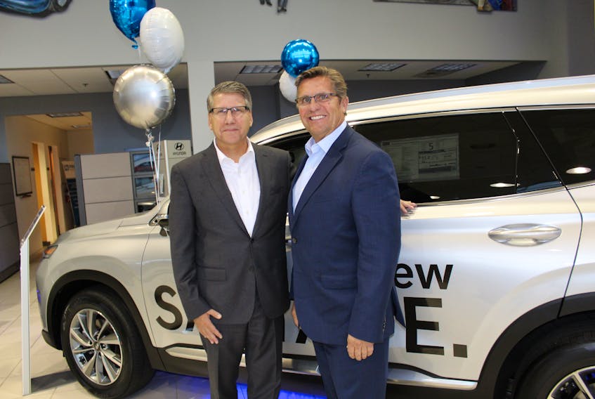 President and CEO of Hyundai Canada, Don Romano (left), and Capital Auto Group president Frank Howard at a customer appreciation event Thursday evening.