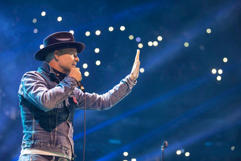 Gord Downie performs at WE Day in Toronto, Oct. 19, 2016. Downie, the poetic lead singer of the Tragically Hip, whose determined fight with brain cancer inspired a nation, died Tuesday night. He was 53.