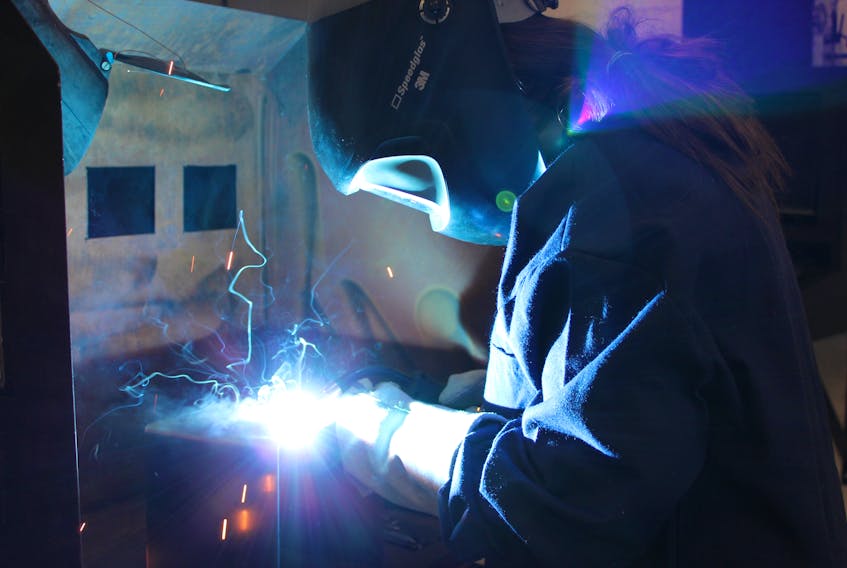 Hayley Martin, a powerline student at the College of the North Atlantic’s Seal Cove campus, tries her hand at welding during the Skills Canada Newfoundland and Labrador’s Annual Skilled Career Day at the Prince Philip Drive campus on Friday.