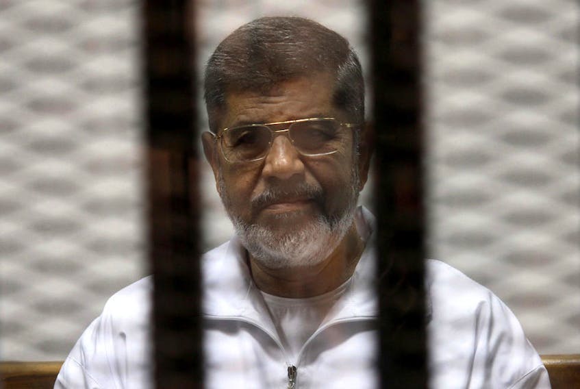 Former Egyptian president Mohamed Morsi at a court appearance in Cairo, May 2014. — Reuters