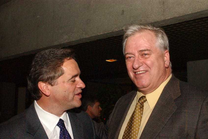In this January 2002 photo, former federal Industry Minister Brian Tobin (left) chats with Beaton Tulk, Newfoundland and Labrador’s then Minister of Development and Rural Renewal in St. John’s following Tobin’s announcement of his resignation from federal politics for the second time. Tulk, who succeeded Tobin as premier of Newfoundland and Labrador in October 2000, died Thursday. He was 75. — Telegram file photo