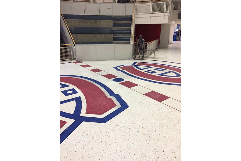 The old Montreal Forum is an entertainment complex now, but the exact spot where centre ice was once located is outlined. There’s also a statue of Maurice ‘Rocket’ Richard, along with a number of original Forum seats. However, they were removed when this photo was taken as renovations are currently under way in the complex.
