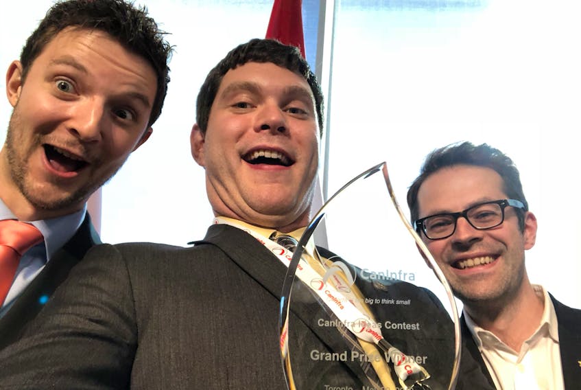 IceGrid team members (from left) Brandon Copeland, Dr. Brett Favaro and Dave Lane celebrate their CanInfra win with a selfie.