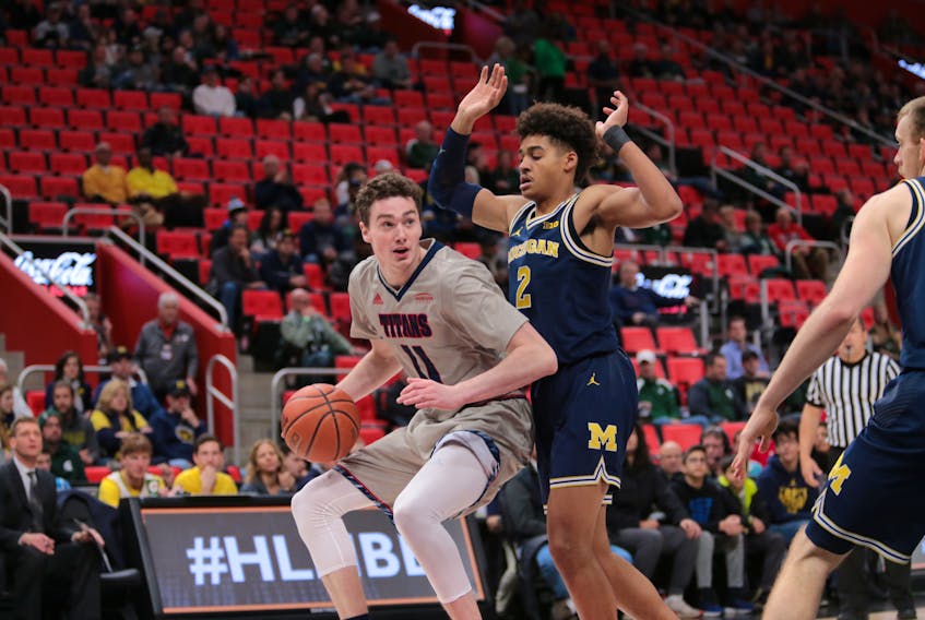 Cole Long (11) of the University of Detroit-Mercy Titans looks for a path to the basket in an NCAA men’s basketball game against the University of Michigan Wolverines during the 2017-18 season. After three years at Detroit-Mercy, Long is back in his native St. John’s with a degree in psychology and two years of remaining eligibility he’ll use to play with the Memorial Sea-Hawks, Long and his new teammates open their 2019-20 Atlantic University Sport season tonight at the Field House against the visiting University of New Brunswick Reds. — Detroit-Mercy Athletics