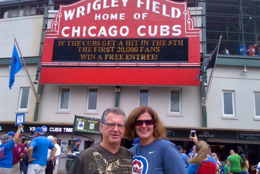 Terry and Diane Hart pose outside the famous facade of Chicago’s Wrigley Field. The Harts, along with Roger and Mary Ann Grimes, just completed a tour of all 30 Major League Baseball parks, an adventure that started six years ago.