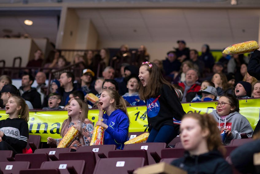Newfoundland Growlers photo/Joe Chase — These young girls seems to be enjoying themselves, cheering on the Newfoundland Growlers during a recent ECHL game at Mile One Centre.