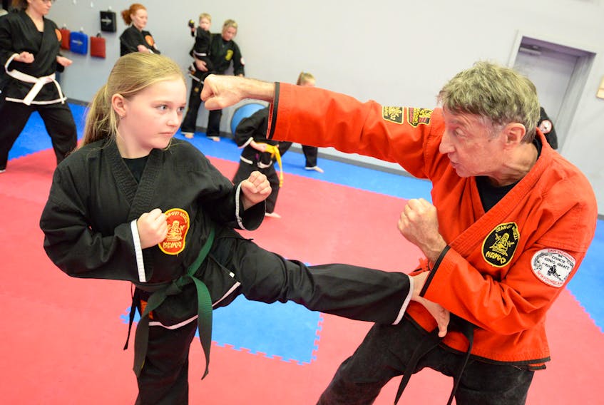 Dave Jackman instructs nine-year-old Danika Wiseman at Rock Athletics in Mount Pearl this week. Jackman, who has been training in Kenpo Karate since 1969, was recently designated a ninth degree black belt.