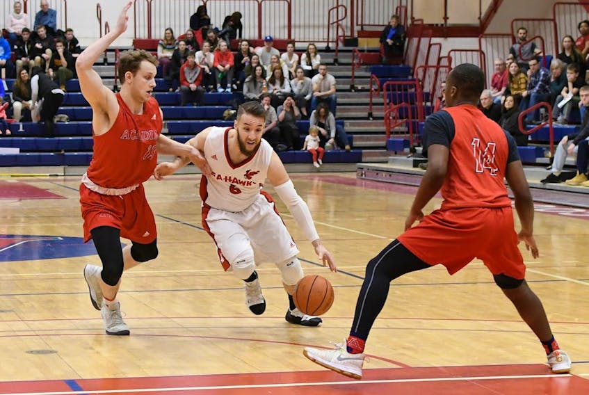 Memorial guard Daniel Foo (centre) spent much of last season as a starter for the Sea-Hawks, but the Corner Brook native is proving to be an energy booster off the bench this fall. — Memorial Athletics photo
