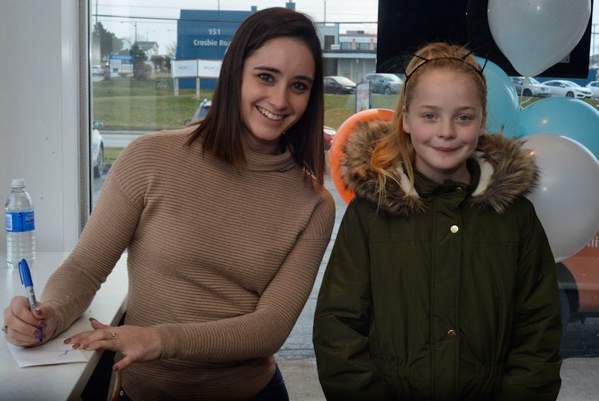 Canadian Olympic figure skater Kaetlyn Osmond met with young fan Faith Goodyear Friday at a Mary Brown's restaurant in St. John's Friday.