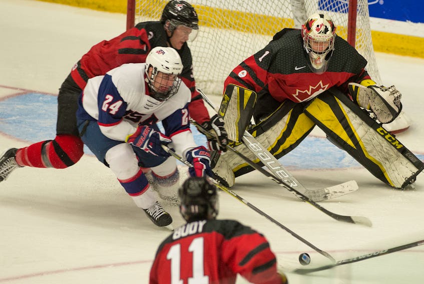 Zach Rose of Paradise keeps his eye on the puck during the 2017 World Junior A Hockey Challenge championship game against the United States in December. Rose was the tournament MVP and all-star goalie, which obviously impressed Bowling Green University. Rose has accepted a full athletic scholarship offer from the Falcons.
