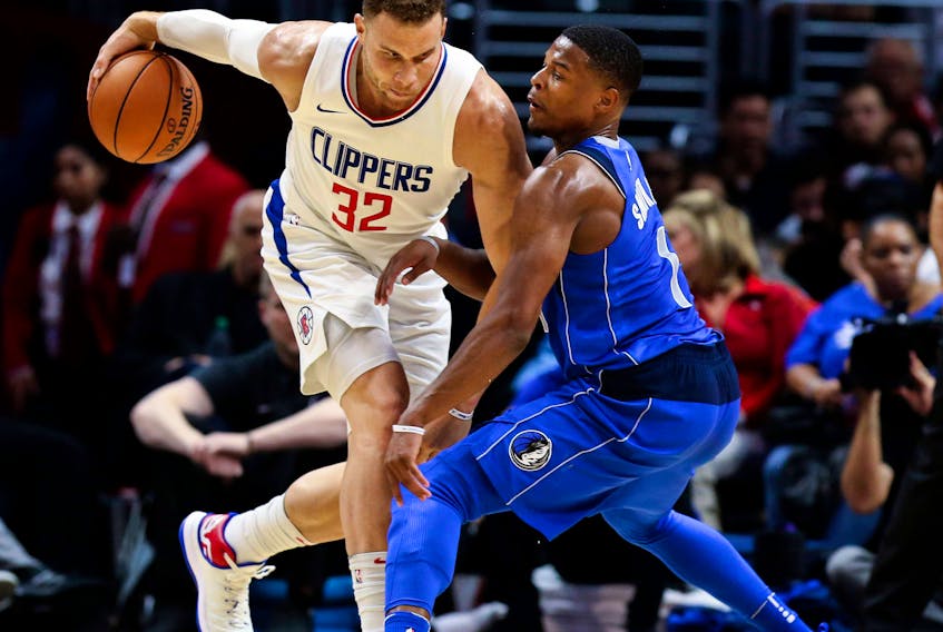 Blake Griffin of the Los Angeles Clippers takes the ball to Dallas Mavericks rookie guard Dennis Smith Jr. during a recent NBA game. Smith Jr. played at NC State last year, where current St. John’s Edge coach Jeff Dunlap was the director of basketball operations.