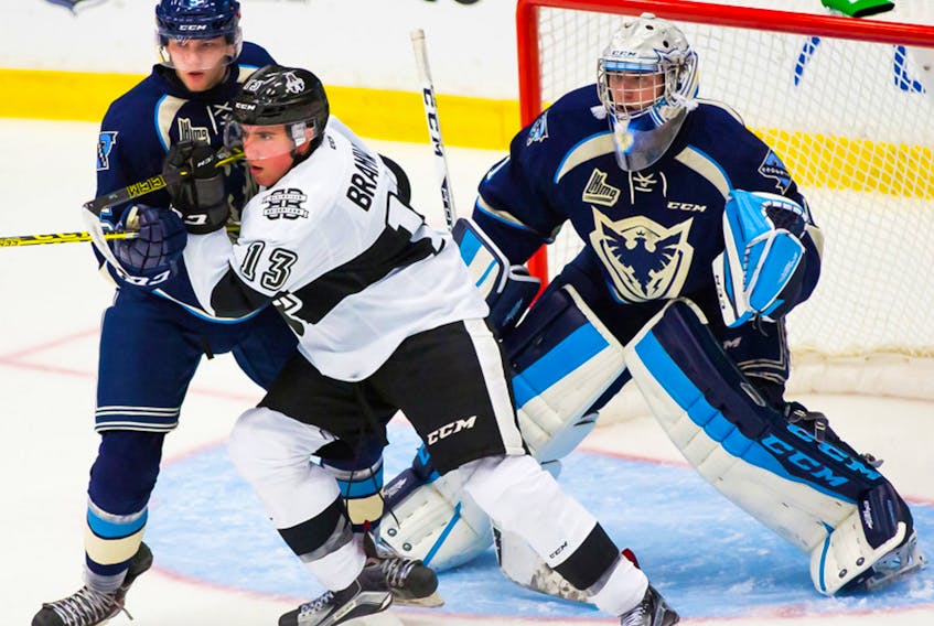 Scottie Greene, left, shown here battling with a Blainville-Boisbriand Armada forward, was an undrafted free agent when he was invited to the Sherbrooke Phoenix camp. Despite the odds, Greene earned a spot in the QMJHL team’s 2015-16 opening day lineup.