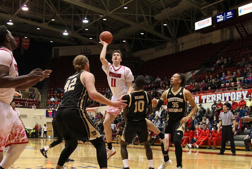 University of Detroit-Mercy photo
Cole Long of St. John’s goes up for two points in a game against Western Michigan earlier this season at Calihan Hall on the University of Detroit-Mercy campus. Long is starting to see his playing time increase.