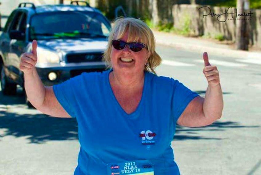 Karen Greene was all smiles as she neared the finish line in this photo taken while she was on the course at the 2017 Tely 10.