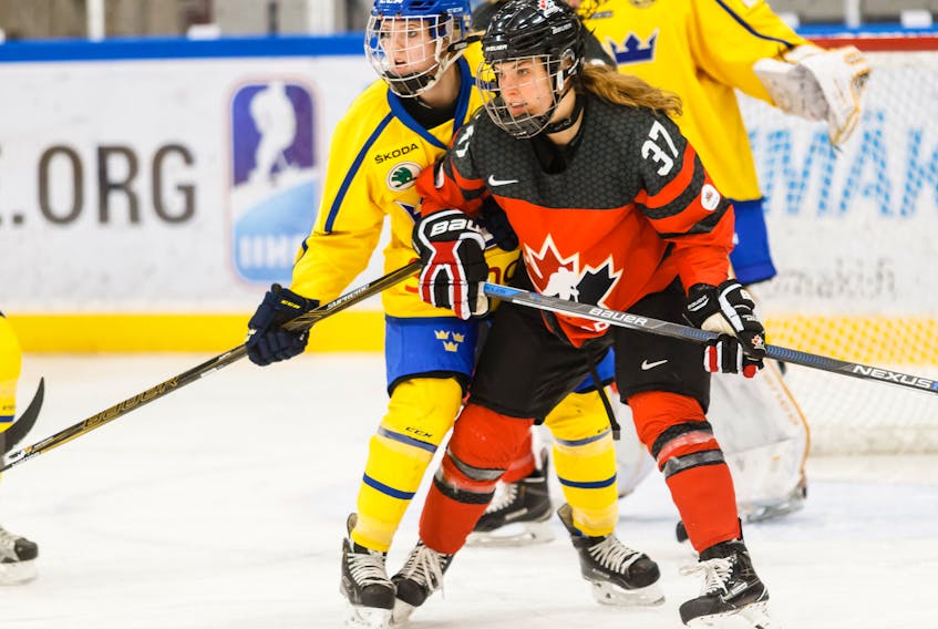Sarah Davis, shown here playing against Sweden, has won three world championship silver medals, and a trio of 4 Nations Cup silver medals.