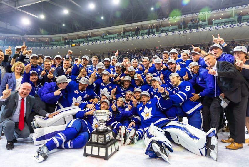 The Toronto Marlies pose for a team photo after their historic Calder Cup win Thursday night in Toronto. Colin Greening of St. John’s was part of the championship team, and is standing between Marlies general manager Kyle Dubas (wearing black glasses) and coach Sheldon Keefe in the middle-to-top-left of the photo, showing the No. 1 sign.