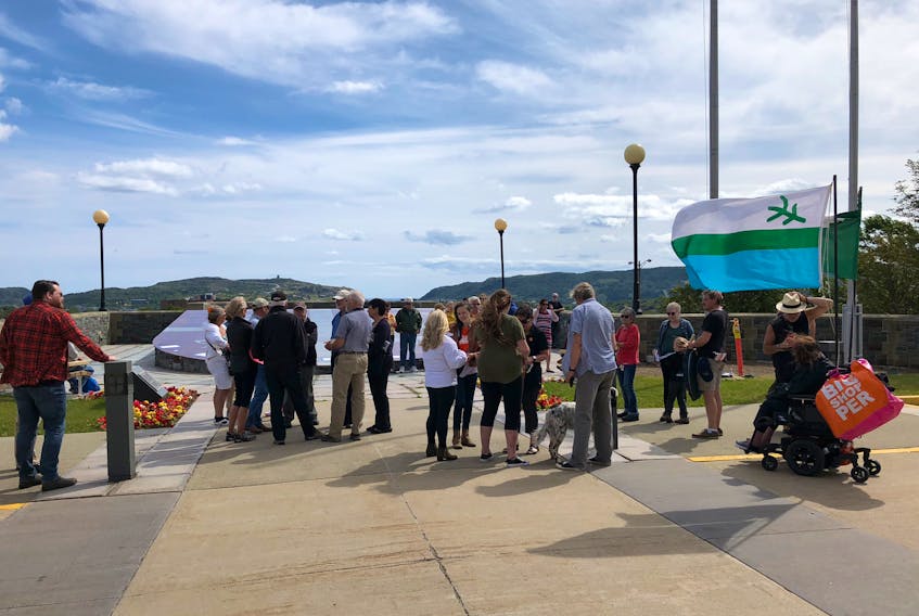 The crowd of about 50 people gathered to participate in the Take Back The Power rally at Confederation Building in St. John's Saturday afternoon.