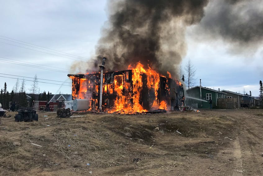 The RCMP is investigating a fire at a home on  Piwas Street in Natuashish. Three people escaped the early morning fire Friday.