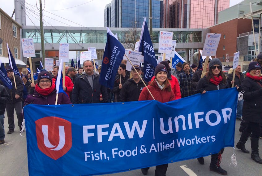 FFAW-Unifor members leave the Delta Hotel in downtown St. John's on their way to the Baine Johnston building, home of Newfoundland and Labrador member of parliament and federal cabinet minister Seamus O'Regan's office.